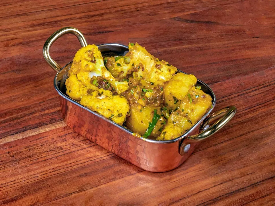 Aloo gobi in a copper pan